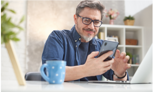 A mature professional working from home, enjoying work-life balance through consulting after 50.
